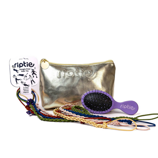 Metallic pouch gift set wtih 5 elastic hair tie ponytail holders and one purple tangle free brush.