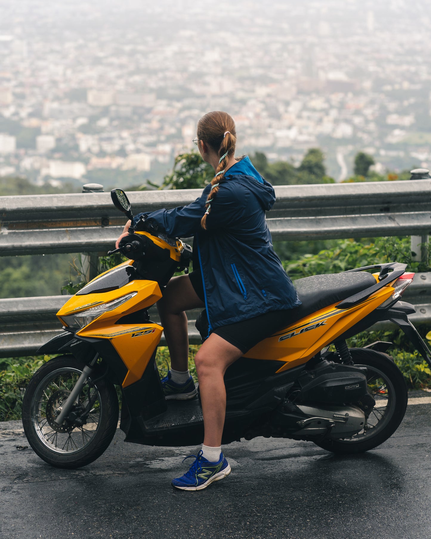 Hair in cute Hair Tie. Woman on motorcycle with hair tie in hair