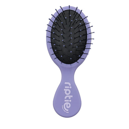 Rip Tie mini detangling brush with lavender handle designed for gentle, tangle-free brushing on fine or short hair